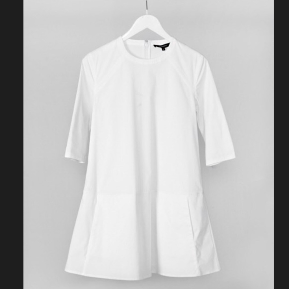 White Poplin party dress with pockets.